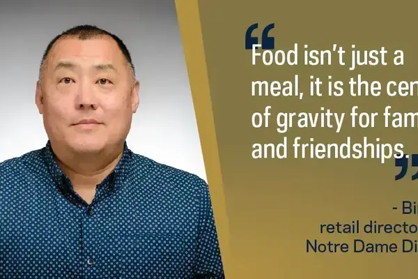 Bin An, retail director for Notre Dame Dining, an East Asian man in a blue patterned shirt.