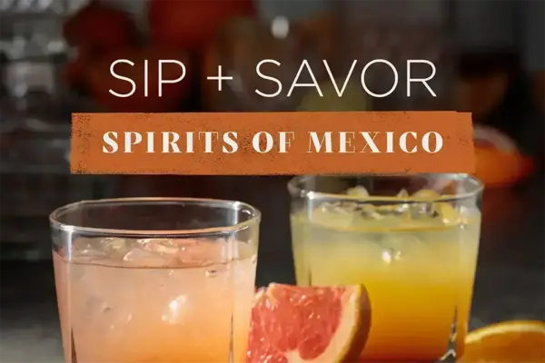 Two glasses of pink and orange cocktails with ice, garnished with grapefruit and orange slices. Text: SIP + SAVOR SPIRITS OF MEXICO.